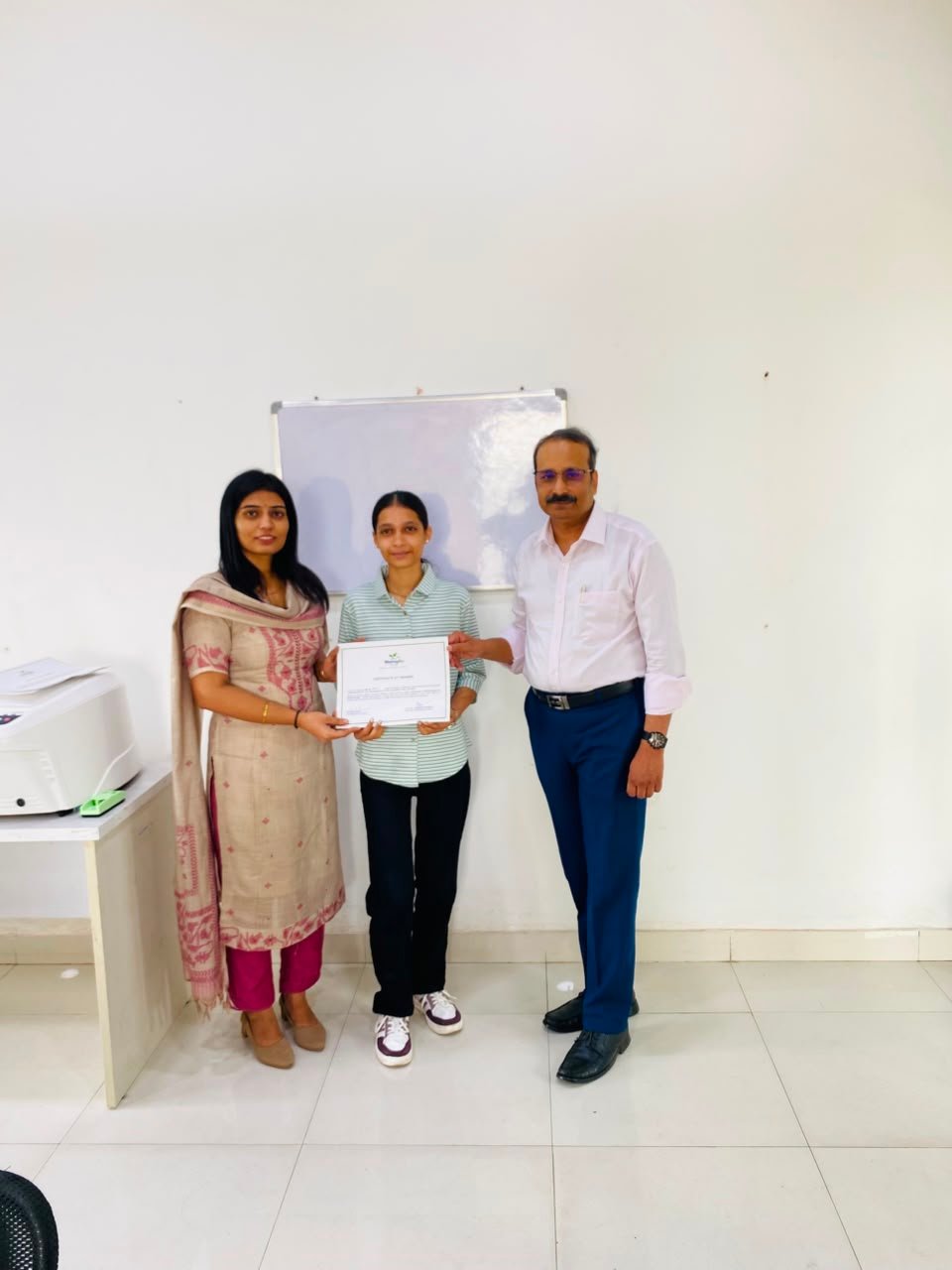 Trainee receiving certificate of training